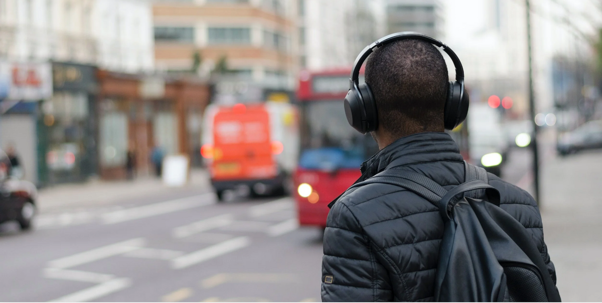 Akoio Case Study featuring a headphone user navigating an urban environment and managing his personal soundscape.